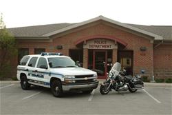 Patrol Unit and Motorcycle Outside of the Police Department
